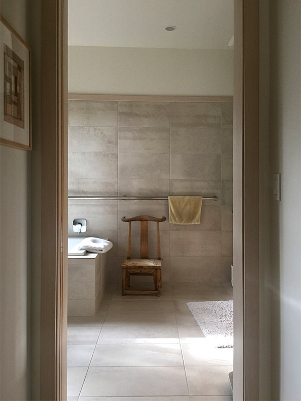 the bathroom as shrine, with chair